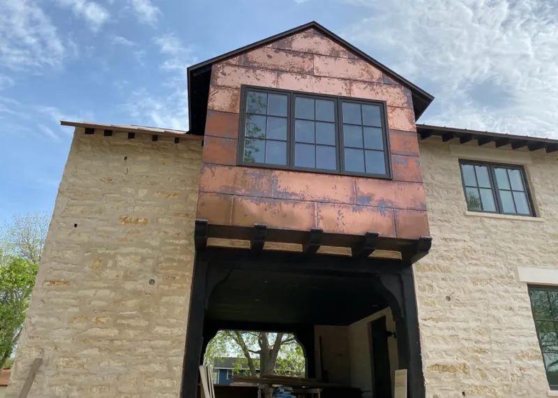 Copper metal panel facade on a stone building for Metal Roof Coating in Highland Springs