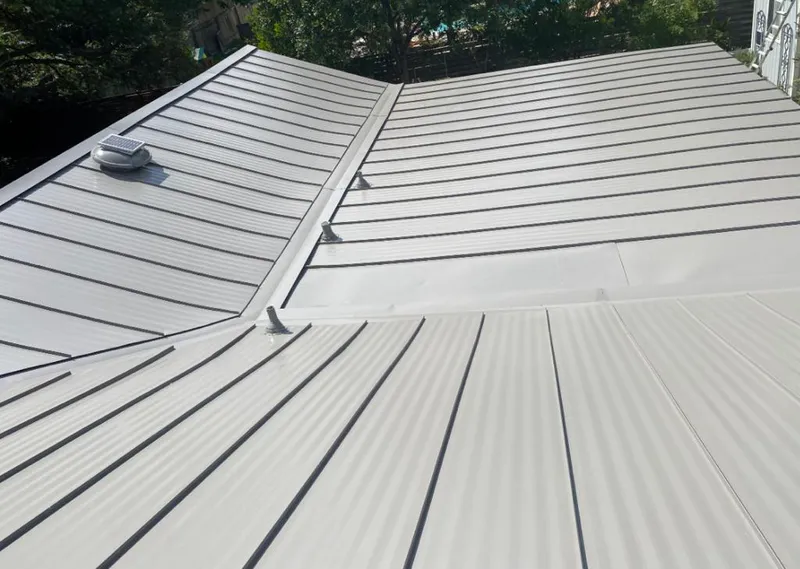 Solar attic fan installed on a metal roof for Roof Ventilation in Highland Springs